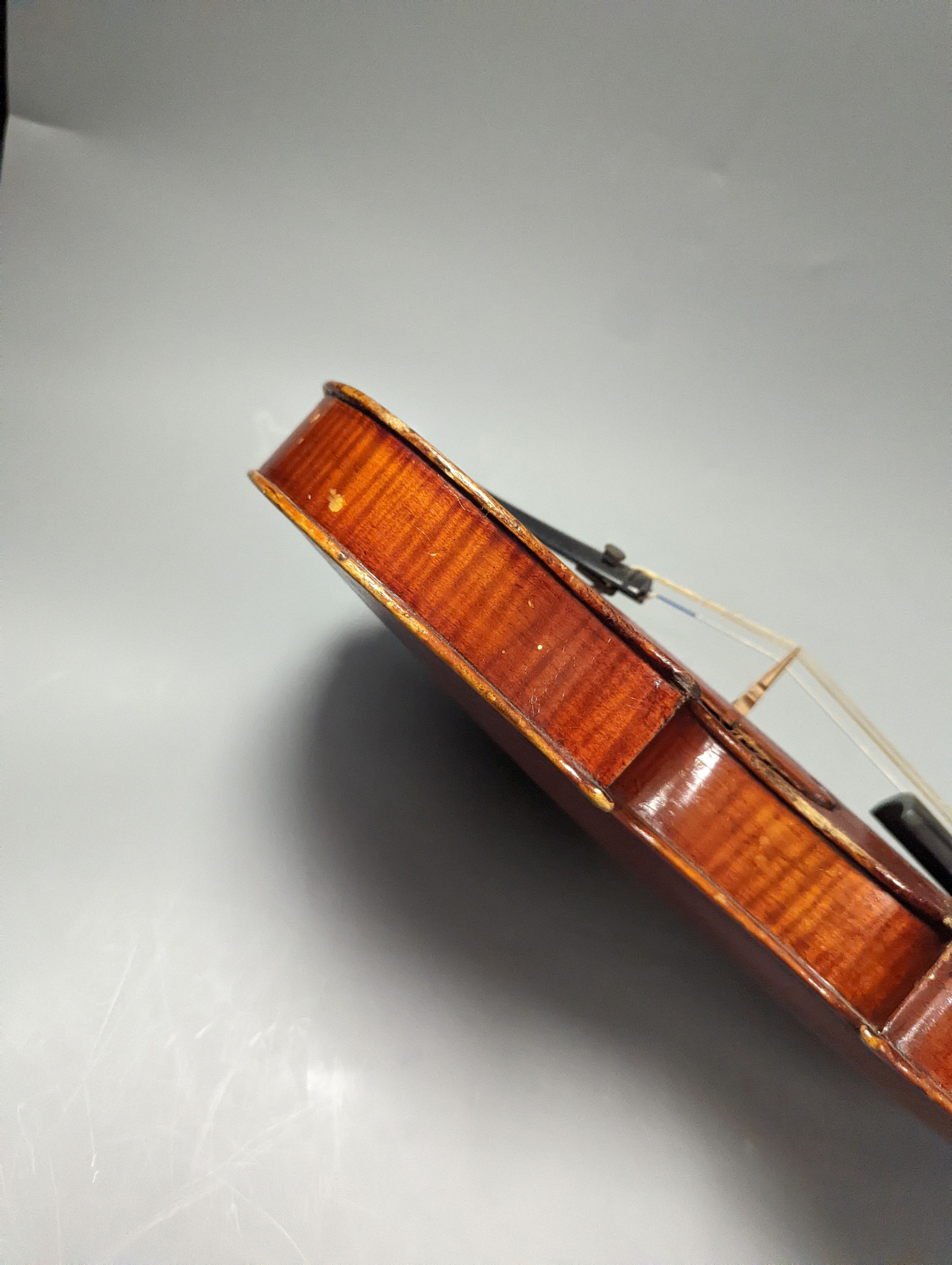 A violin in a mahogany case, case makers, Withers and sons, case 79 cms high.